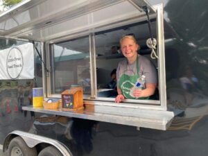 Amy Kelly serving with House of Prayer's new ministry - the Little Free Food Truck.